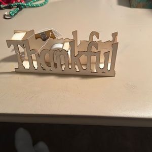 I have a new with tags thankful sign it comes from a non smoking & pet free home